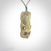 Hand carved incredible Deer Antler  wheku face carving. A stunning work of art. This pendant was hand carved in Deer Antler with Paua Shell inlay for the eyes. Shipping is included in the price. Delivered to you on an adjustable cord.